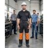 Pantalon de travail Noir et orange — mise en situation : Industrie, Portrait individuel