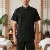 Tunique de travail homme noire 100 % coton portée en institut spa